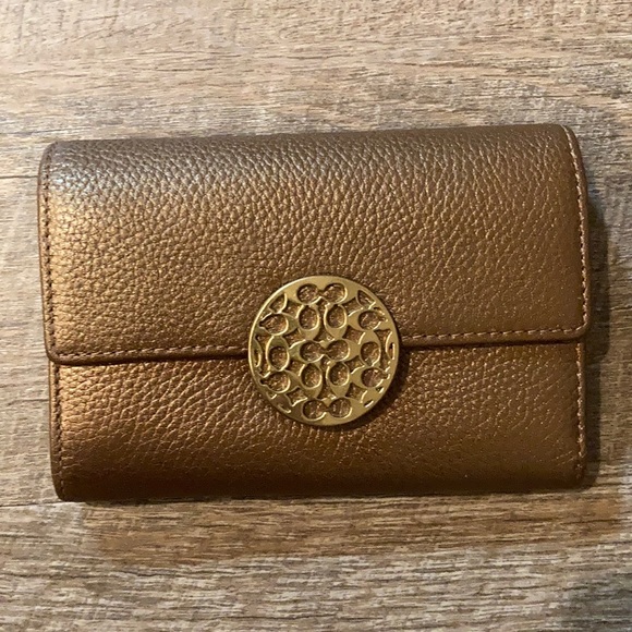 Coach Handbags - Coach dark gold leather bi fold clutch wallet
